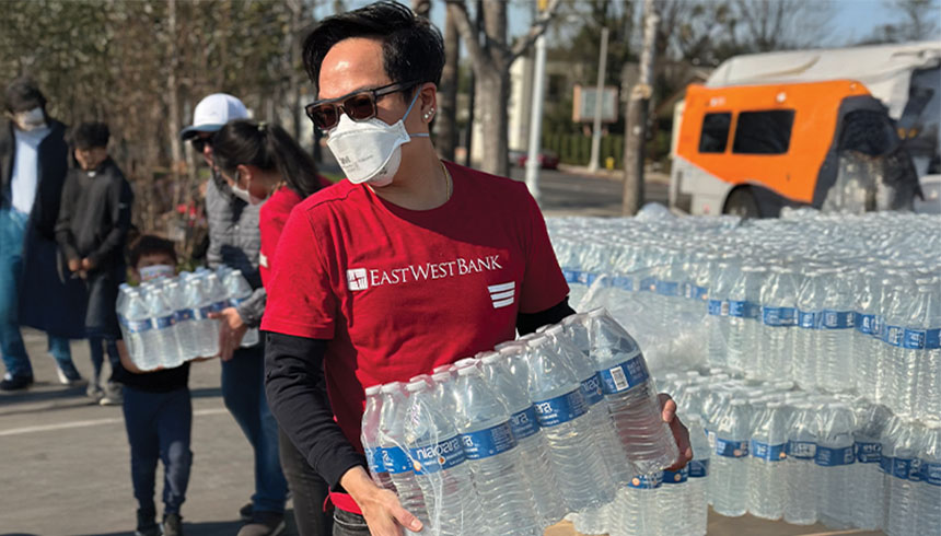 volunteer carrying water