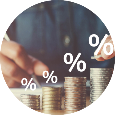 A person holds several US hundred-dollar bills.