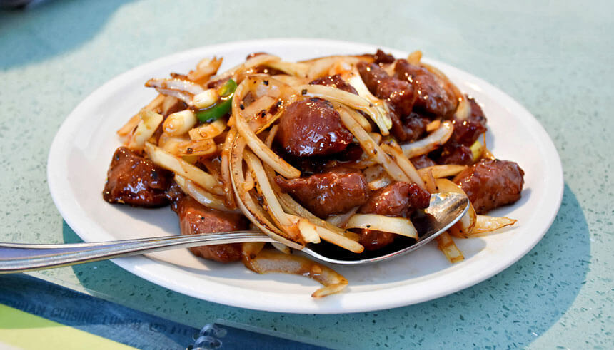 A plate with filet mignon cubes from Henry's Cuisine