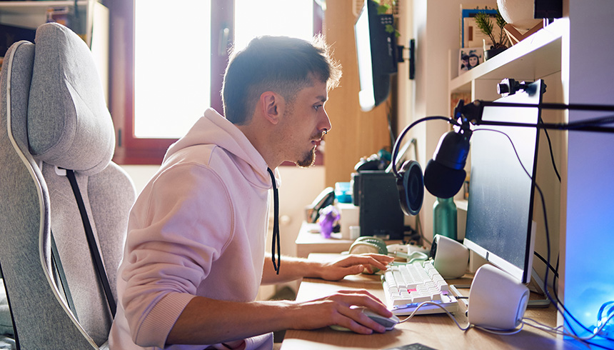 Content creator using a computer in a home office