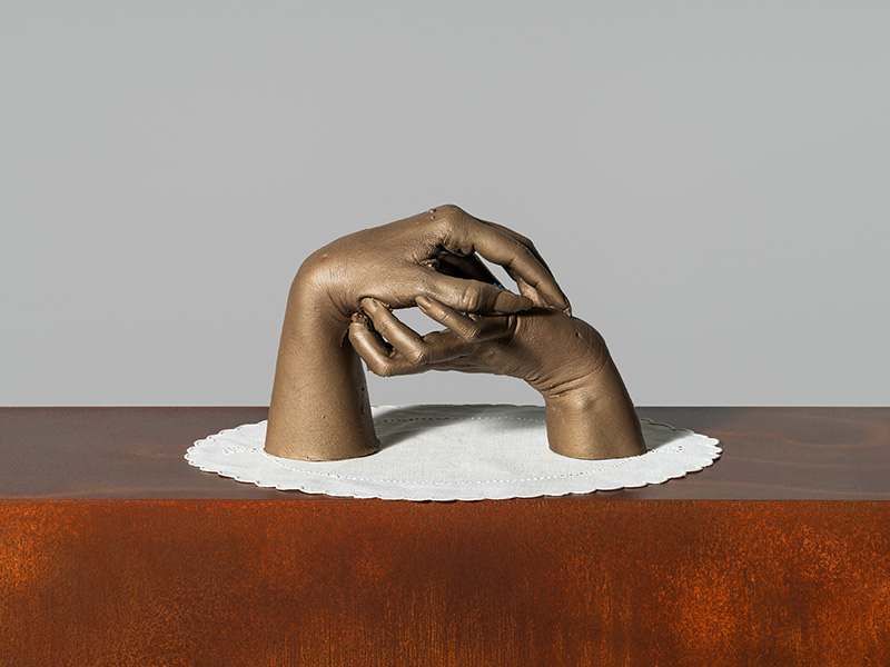 Monument (Shelter), 2025. Lost-wax cast bronze, inherited doily, patinated burn-out cast bronze, weathering steel.