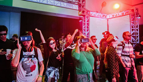 A group of people wearing Wave VR headsets that enable them to view and socialize in music shows worldwide