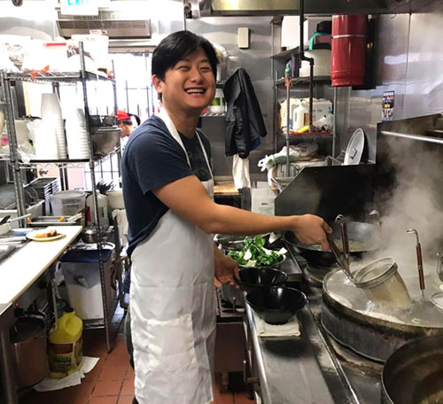 Ken Zhu, the owner of Luscious Dumplings, in the kitchen