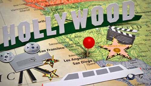 Scrapbooking around the map of Los Angeles with entertainment and Hollywood props
