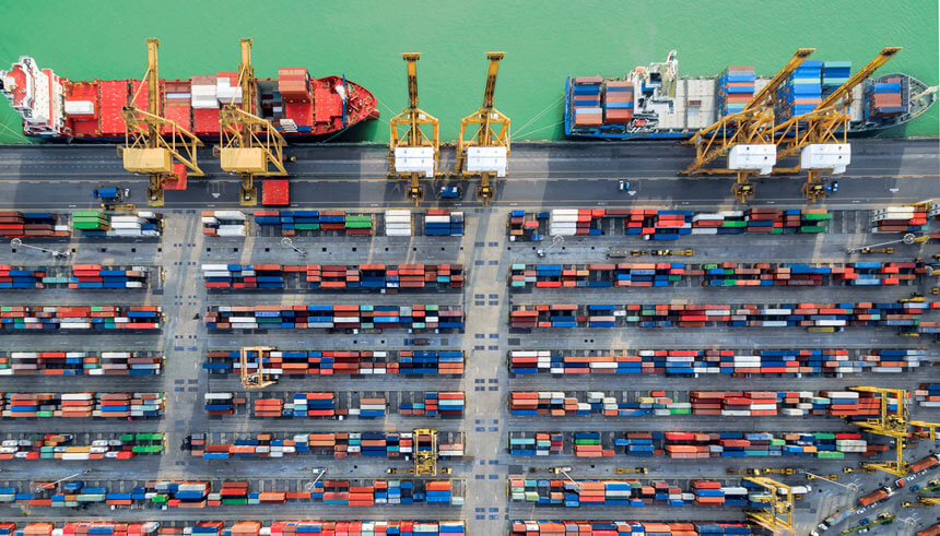 An ariel view of container harbor and cranes