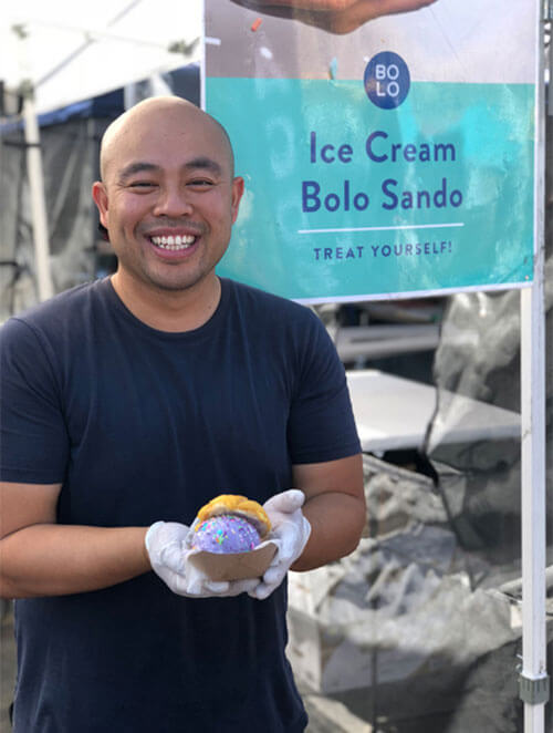One of the founders of Bolo, Joey Ngoy, holding Ube Bae Ice Cream sandwhich