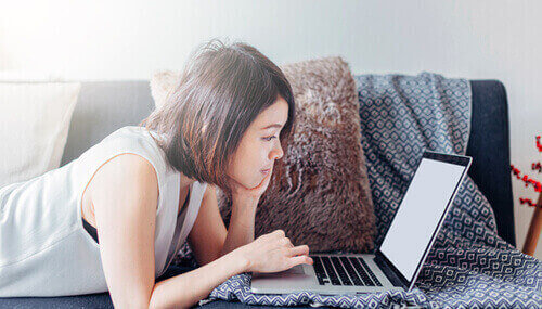 Girl looking at her laptop