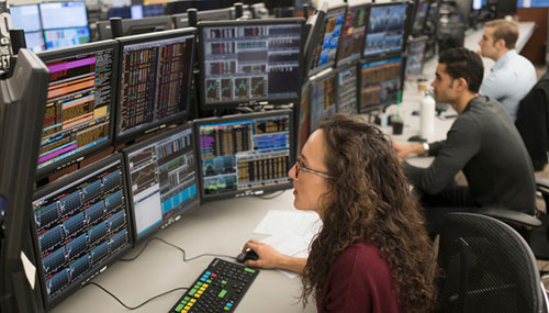 Female trader analyzing stock market