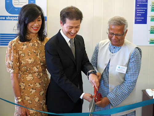 Ribbon cutting at the new Grameen LA headquarters with Andrea Jung, Dominic Ng, and Muhammad Yunus