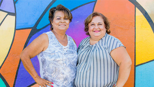 Prudencia and Lorena at the launch of Grameen America’s Long Beach branch